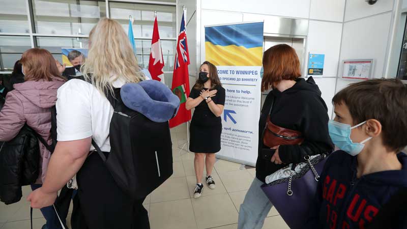 Canada welcomes first federal charter flight for Ukrainians in Winnipeg